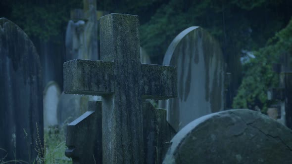 Gravestones In Heavy Rain On Stormy Evening