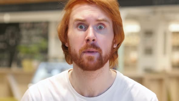 Portrait of Redhead Beard Man in Anger Yelling in Cafe