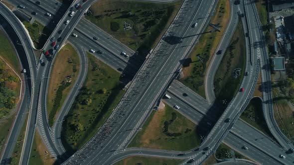 Aerial Drone Footage. Top Circular View Marathon Running on the Road Junction, Wide Shot