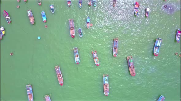 Close Aerial View Over Fishing Boats Sailing on Azure Sea