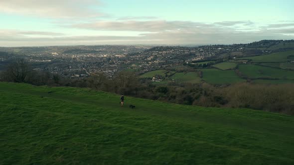 Aerial Drone Countryside Runner With Dog Sunrise Sunset Hilltop View