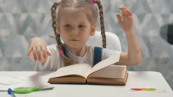 Portrait of Little Girl with Pigtails