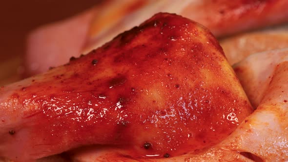 Seasoned slice of ham with bread close up view, macro shot. Rotating motion shot in 4k.