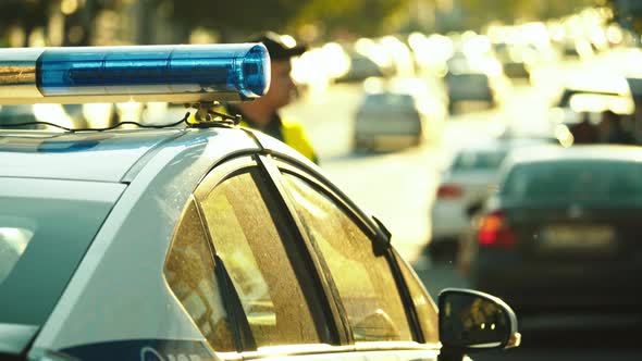 Flashing Flasher on the Roof of a Police Car. Blinker. Close-up.