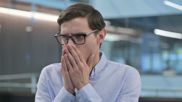 Portrait of Sick Young Man Coughing