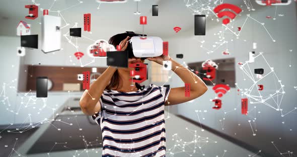 Woman using virtual reality headset with digitally generated icons 4k