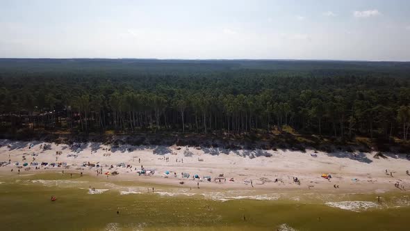 Baltic Sea beach aerial shot. Beautiful, secluded beach on Baltic Sea coast. Sideways flight looking