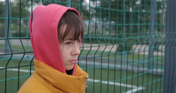 Girl By Fence on Playground