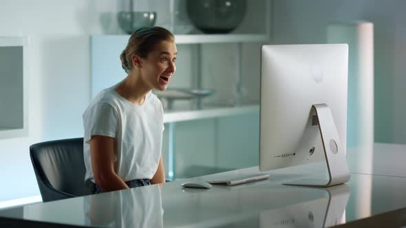 Excited Girl Having Video Call at Home Office