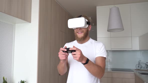 Funny Angry Young Man Gamer Wear Vr Headset Playing Video Game at Home
