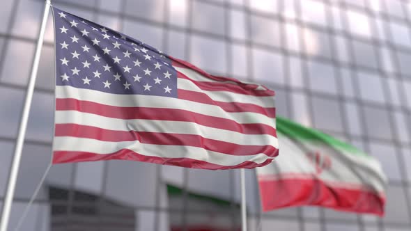 Waving Flags of the USA and Iran in Front of a Skyscraper