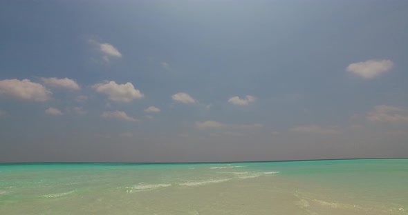 Wide drone clean view of a summer white paradise sand beach and turquoise sea background in best qua