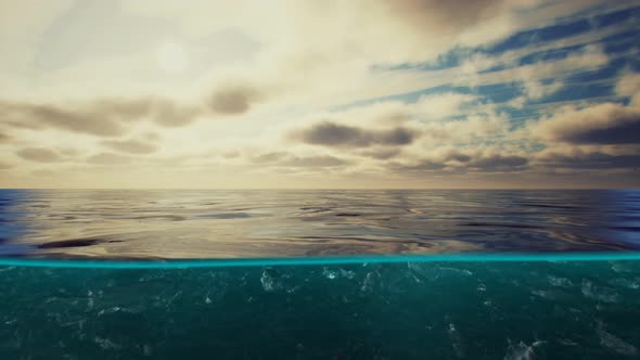 Split View Over and Under Water in the Caribbean Sea with Clouds