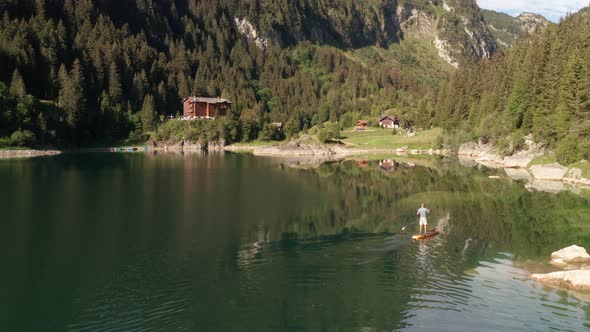 Aerial of man supping on lake