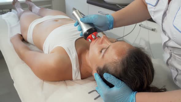 Professional Beautician Doing Rf-lifting on Her Female Client