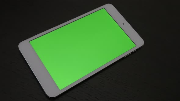 Tablet computer green screen display panning 4K 2160p 30fps UltraHD footage - Close-up of chroma key