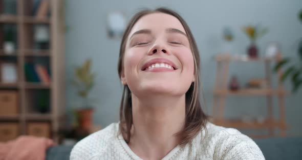 Close Up View of Female Joyful Person Having Video Call and Using Frontal Camera of Smartphone