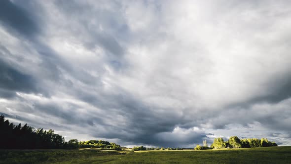 Time lapse footage of clouds moving above the fields