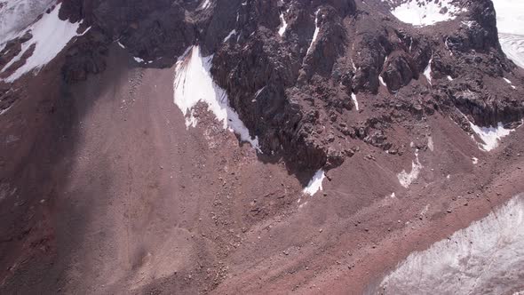 High Rocky Mountains Covered with Ice in Places