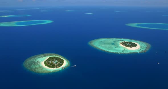 Aerial drone view of scenic tropical islands in the Maldives.