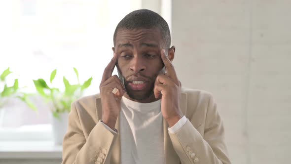 Portrait of African Man Having Headache