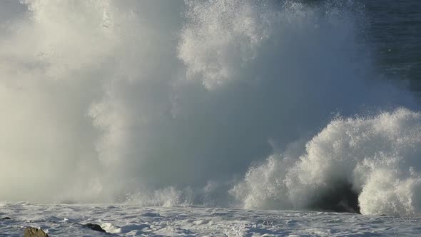Large Breaking Wave On Coastal Rocks