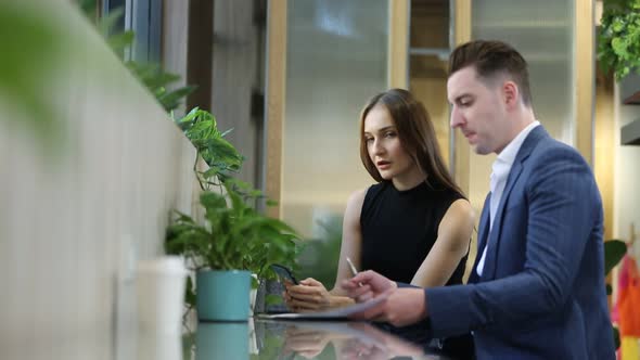 Business People Talking In a Cafe