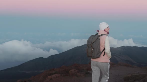 Outdoor Adventure  Slow Motion Woman Hiking Mountain with Pink Sunset Sky USA