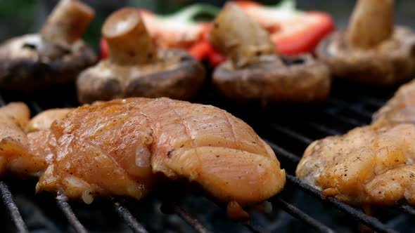 Frying Marinated Chicken Breast Steak Cooked on Grill or Barbecue Grid