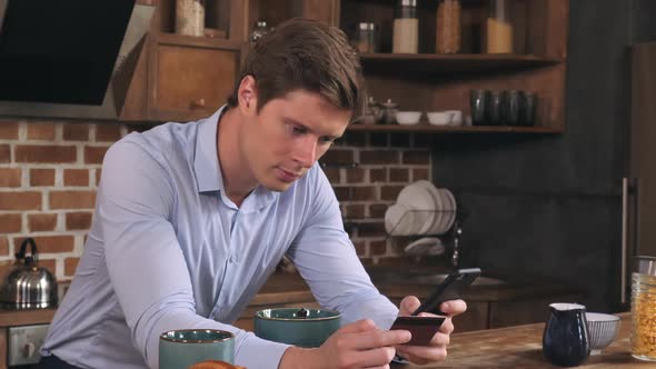 Guy Booking Tickets Using Internet in Apartment