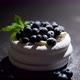 Mini Meringue Dessert Pavlova Cake with Fresh Blueberries Plased on Dark Rusty Table - VideoHive Item for Sale
