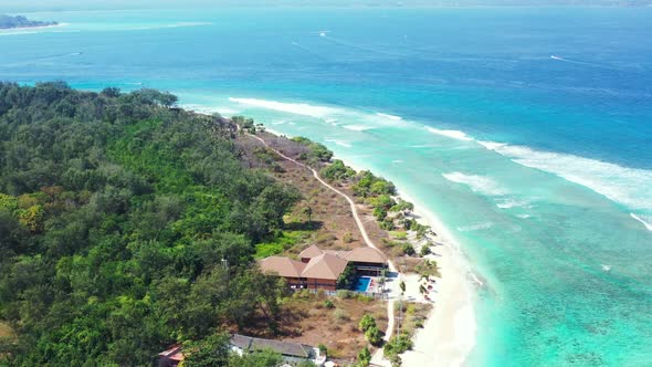 Aerial drone shot abstract of tranquil coast beach adventure by blue ocean with white sand backgroun