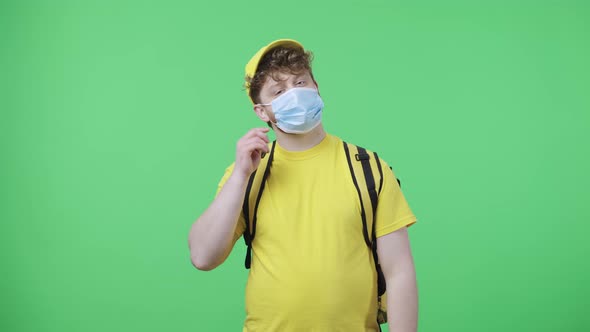 Portrait of Young Men Removing the Medical Mask and Sighing with Relief