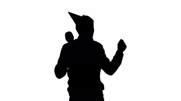 Man in Cap Dances at a Party . White Background. Silhouette