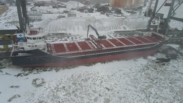 Cargo ship in winter port closeup