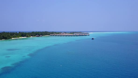 Drone aerial travel of tourist beach by blue lagoon with sand background