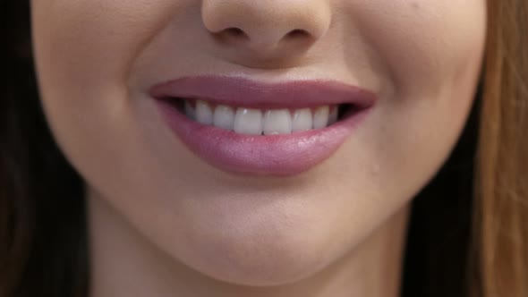 Close Up of Smiling Girl Lips