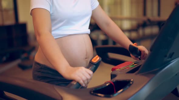 Active Pregnant Woman Exercise in Fitness Center