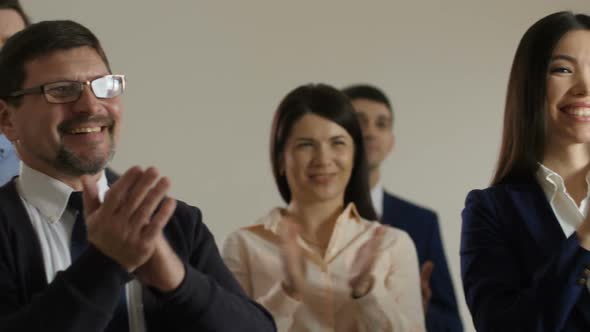 Close Up Members of Seminar Applauding Speaker