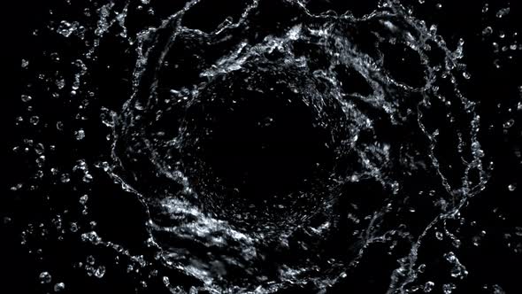 Super Slow Motion Shot of Rotating Water Splash Isolated on Black Background at 1000Fps