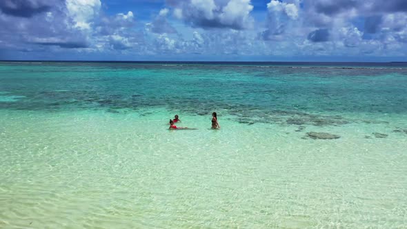 Women best friends on exotic sea view beach journey by transparent sea and white sandy background of