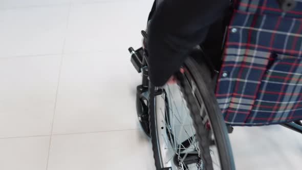 Businesswoman in Wheelchair in Office Corridor