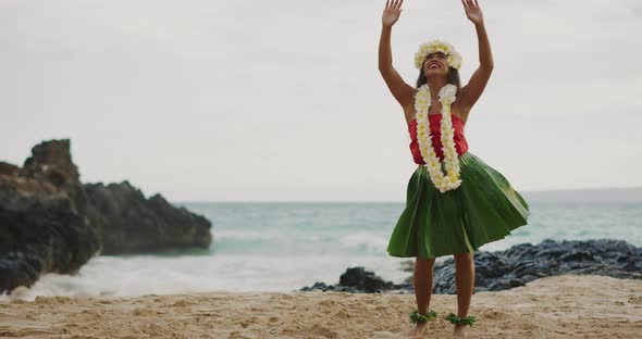 Woman performing Hawaiian hula on the beach