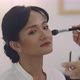 Asian Wedding Makeup Artist Making A Make Up For Bride. Artist Applying Cosmetic On Bride Face. - VideoHive Item for Sale