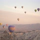 Colourful Hot Air Balloons Hover Over Mountainous Landscape - VideoHive Item for Sale