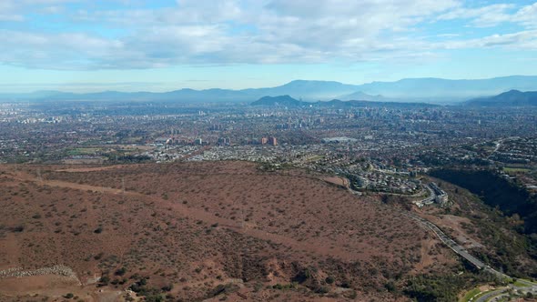 Aerial view dolly in of the city of Santiago, in the commune of Las Condes, the skyline and its isla