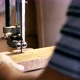 Closeup hands of male carpenter working on milling machine with wood detail - VideoHive Item for Sale