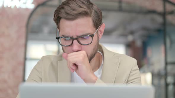 Close Up of Man with Laptop Having Coughing