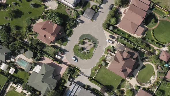 Establishing Shot of Cottage Township with Solar Photovoltaic Panels Arrays on the Roofs