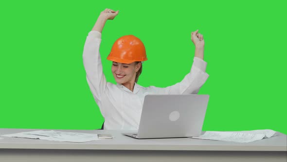 Female Chief Engineer Celebrate a Successful Finish of Project Smiling on a Green Screen Chroma